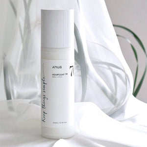 Close-up of Anua Heartleaf lotion showing product texture and packaging