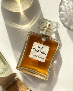 Chanel No. 5 perfume bottle with gold accents