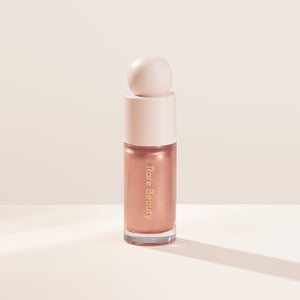 Rare Beauty Positive Light Liquid Luminizer Highlighter available in Pakistan – glowing dewy finish