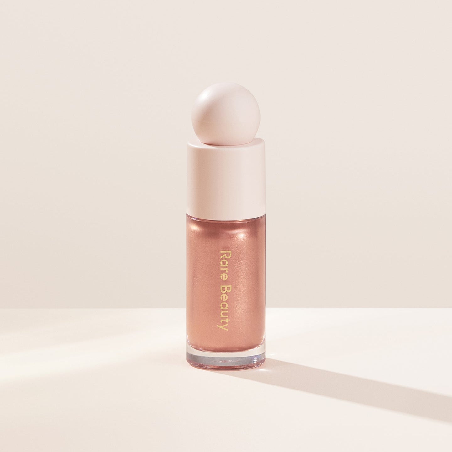 Rare Beauty Positive Light Liquid Luminizer Highlighter available in Pakistan – glowing dewy finish